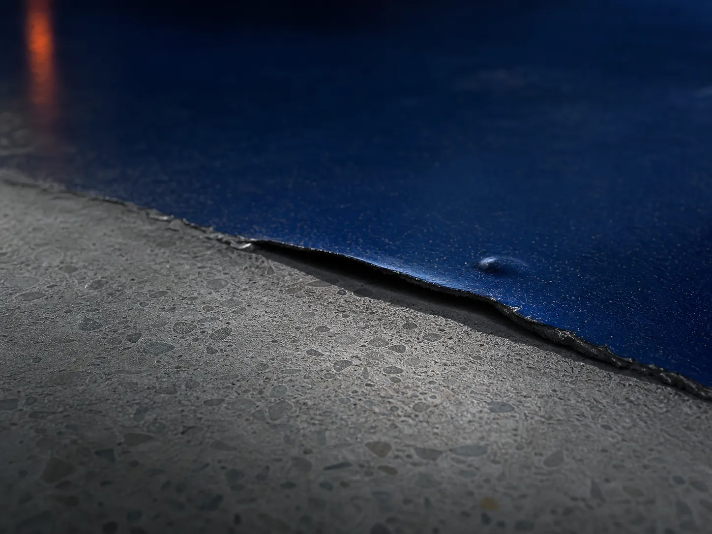 Coating edges lift, blisters form, or fine concrete dust keeps returning after cleaning.