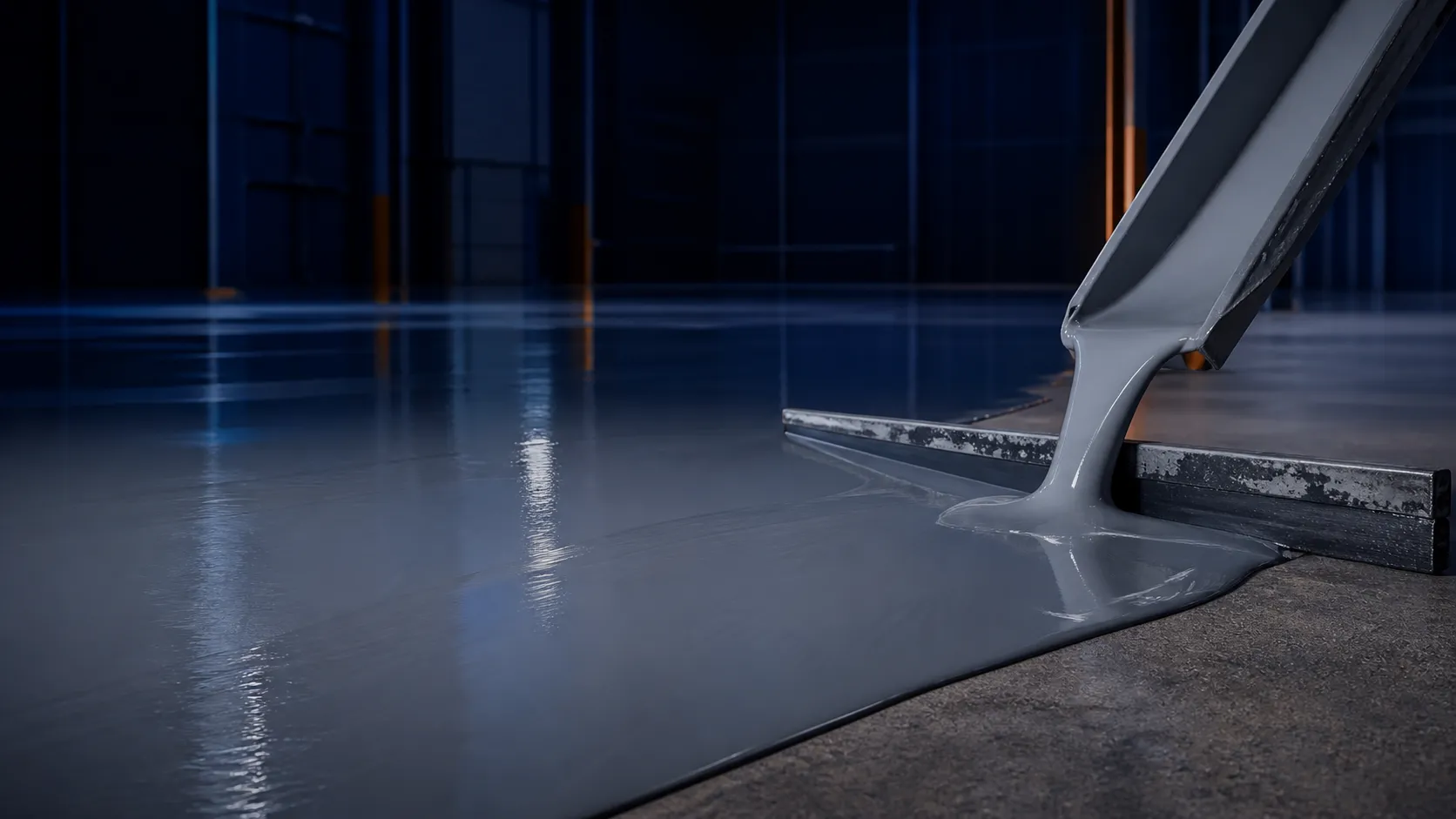 Viscous self-levelling epoxy flowing across a prepared industrial floor beside a steel squeegee