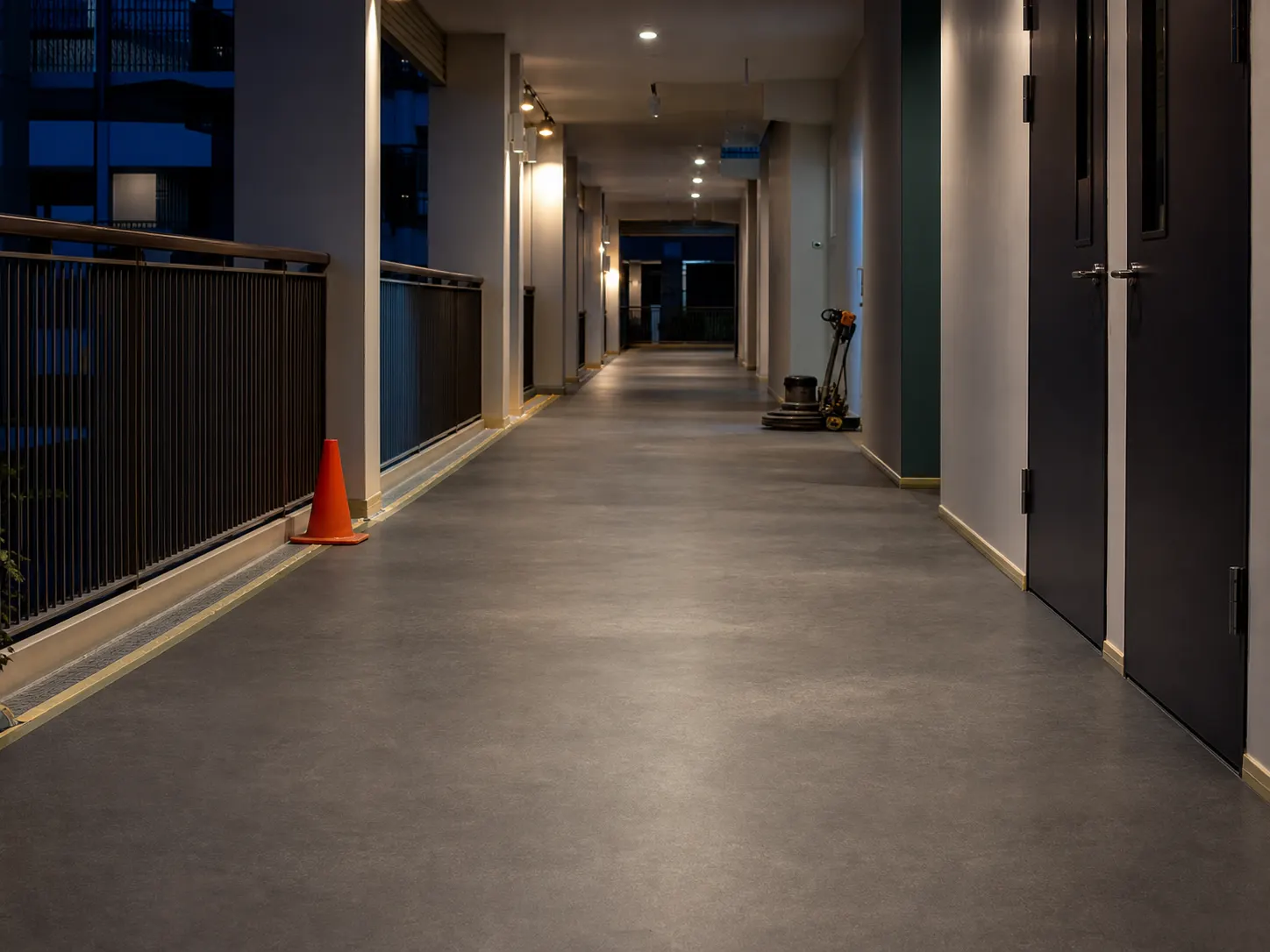 Occupied-building corridor prepared for an overnight floor programme